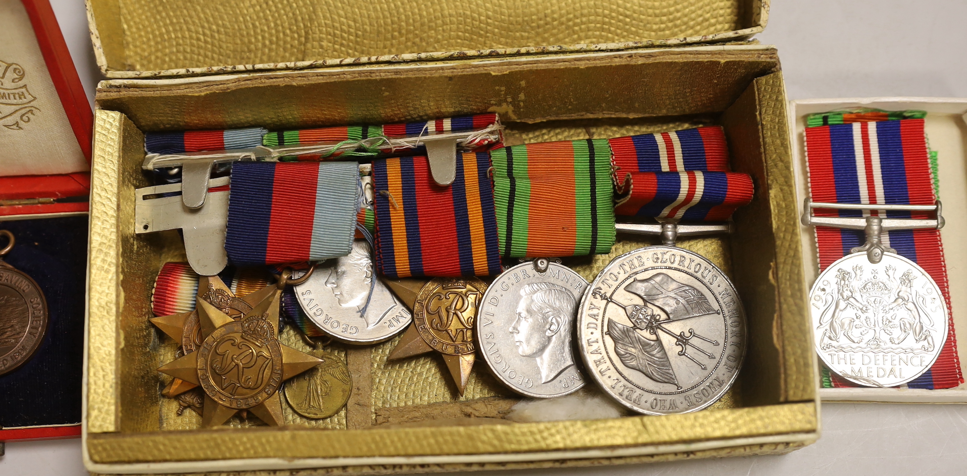 Three WWII medal groups and a German medal etc.